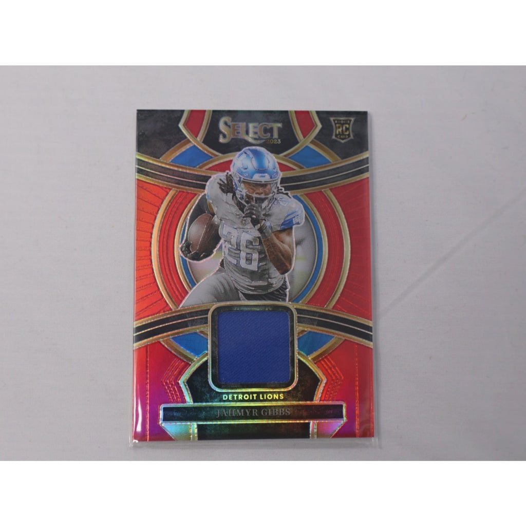 2023 Panini Select - Rookie Swatches Jahmyr Gibbs #RSW-JGI Red Prizm RC Mint