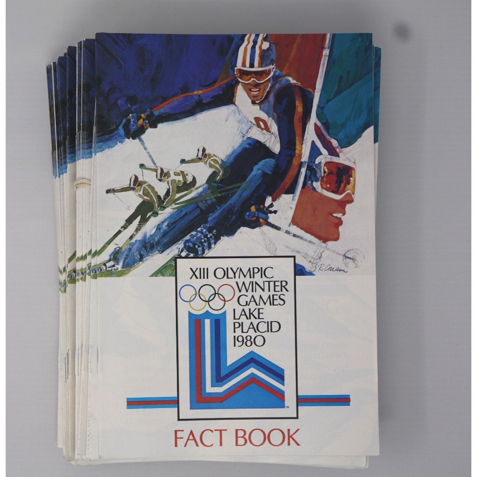 1980 Lake Placid Winter Olympics fact book guide book lot featuring Miracle on Ice hockey memorabilia front view