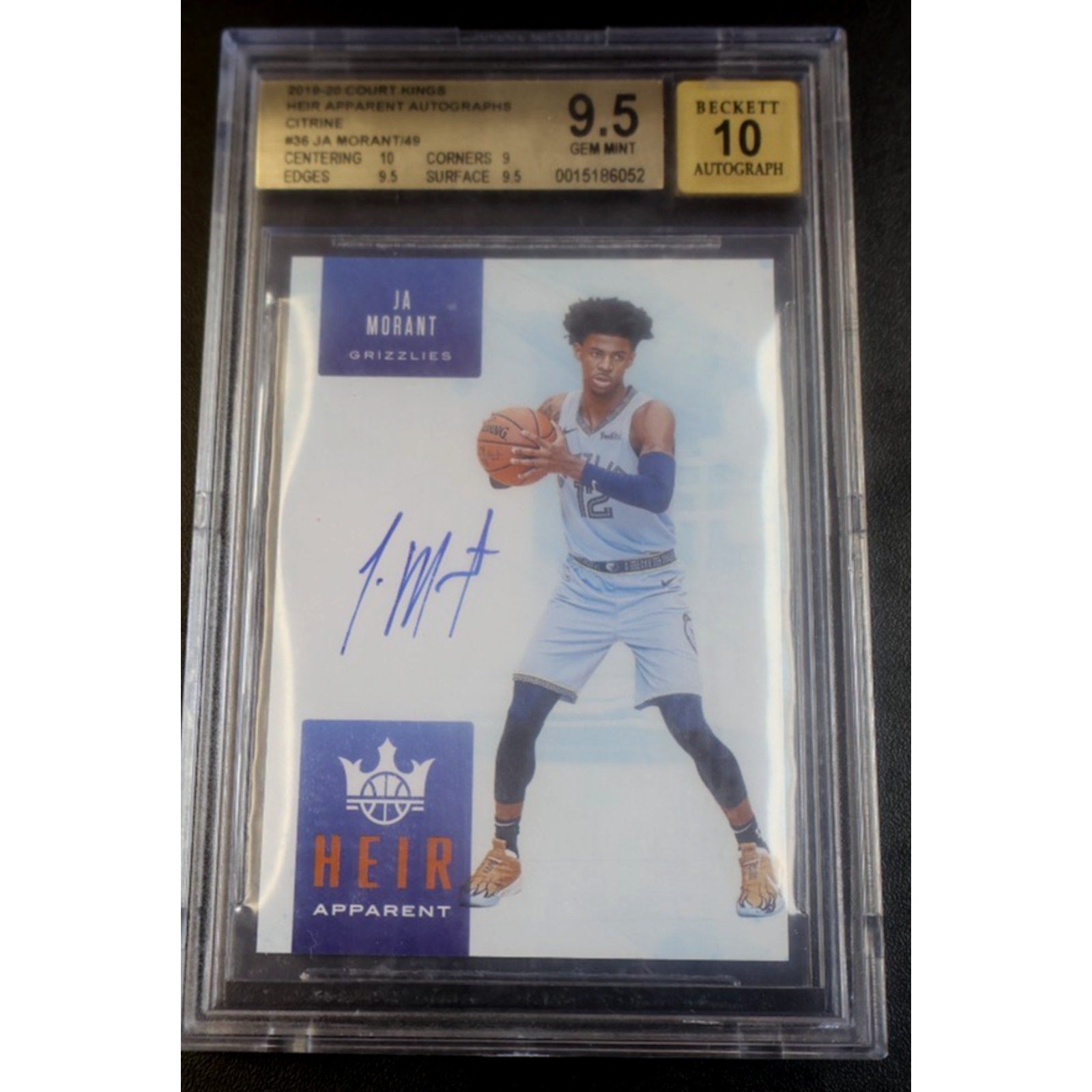 Basketball trading card with player image and autograph, encased in a protective holder.