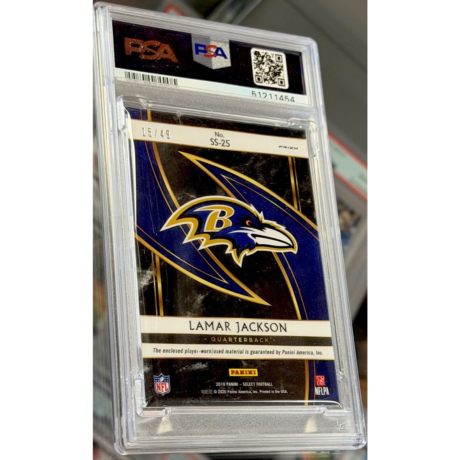 Trading card of Lamar Jackson in a PSA protective case