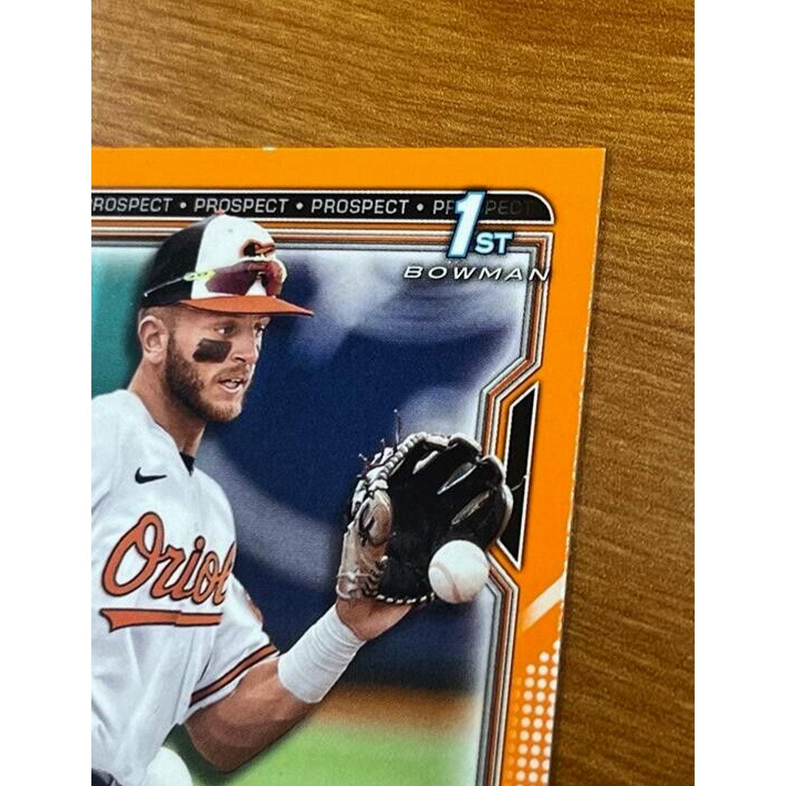 Close-up front view of 2021 Bowman Draft Connor Norby Orange Refractor rookie baseball card