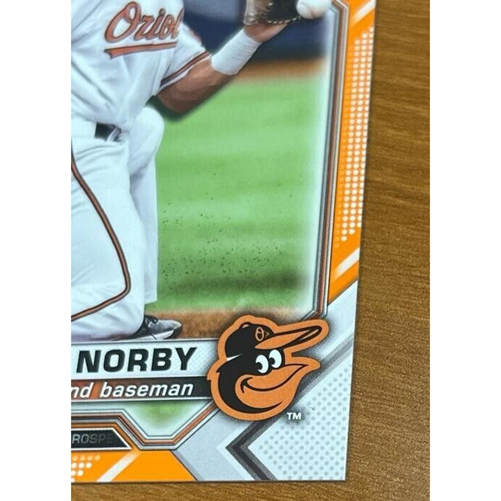 Detailed lower section of Connor Norby 2021 Bowman Draft Orange Refractor card