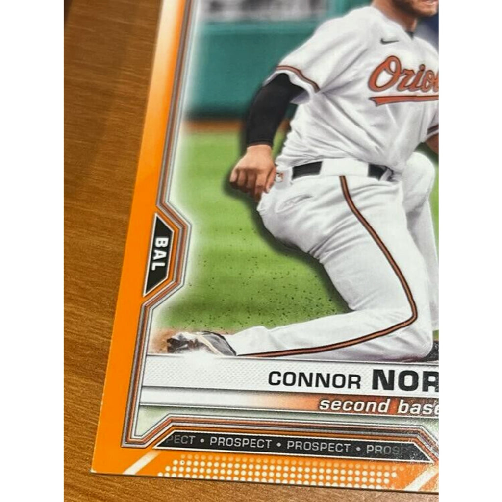 Connor Norby rookie card front corner detail from 2021 Bowman Draft Orange Refractor /25