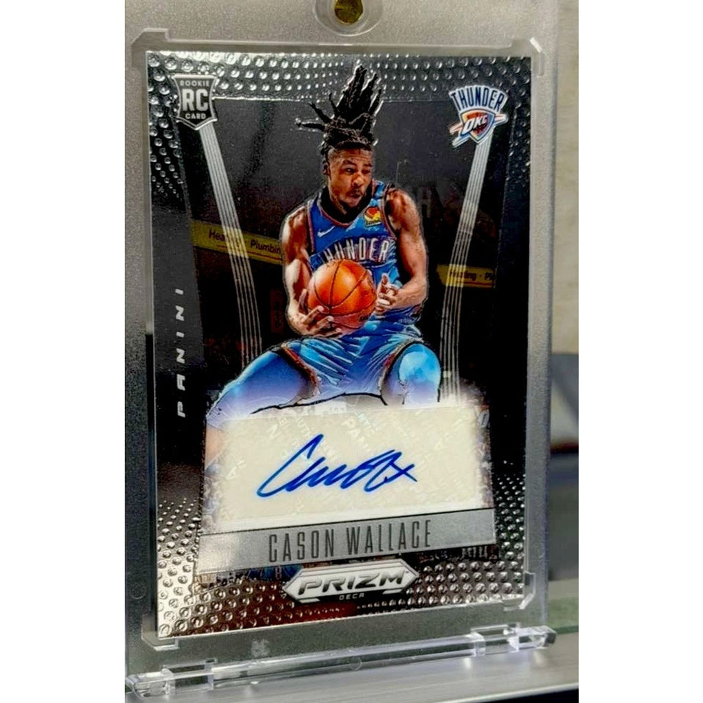 Basketball trading card of a player in a blue jersey with a signature, encased in clear plastic.