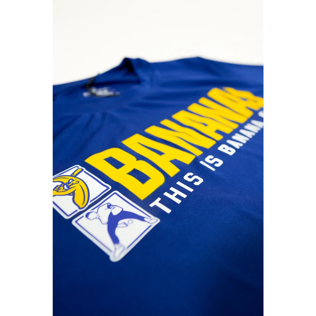 Close-up angled view of Savannah Bananas “This Is Banana Ball” front graphic on blue tech tee