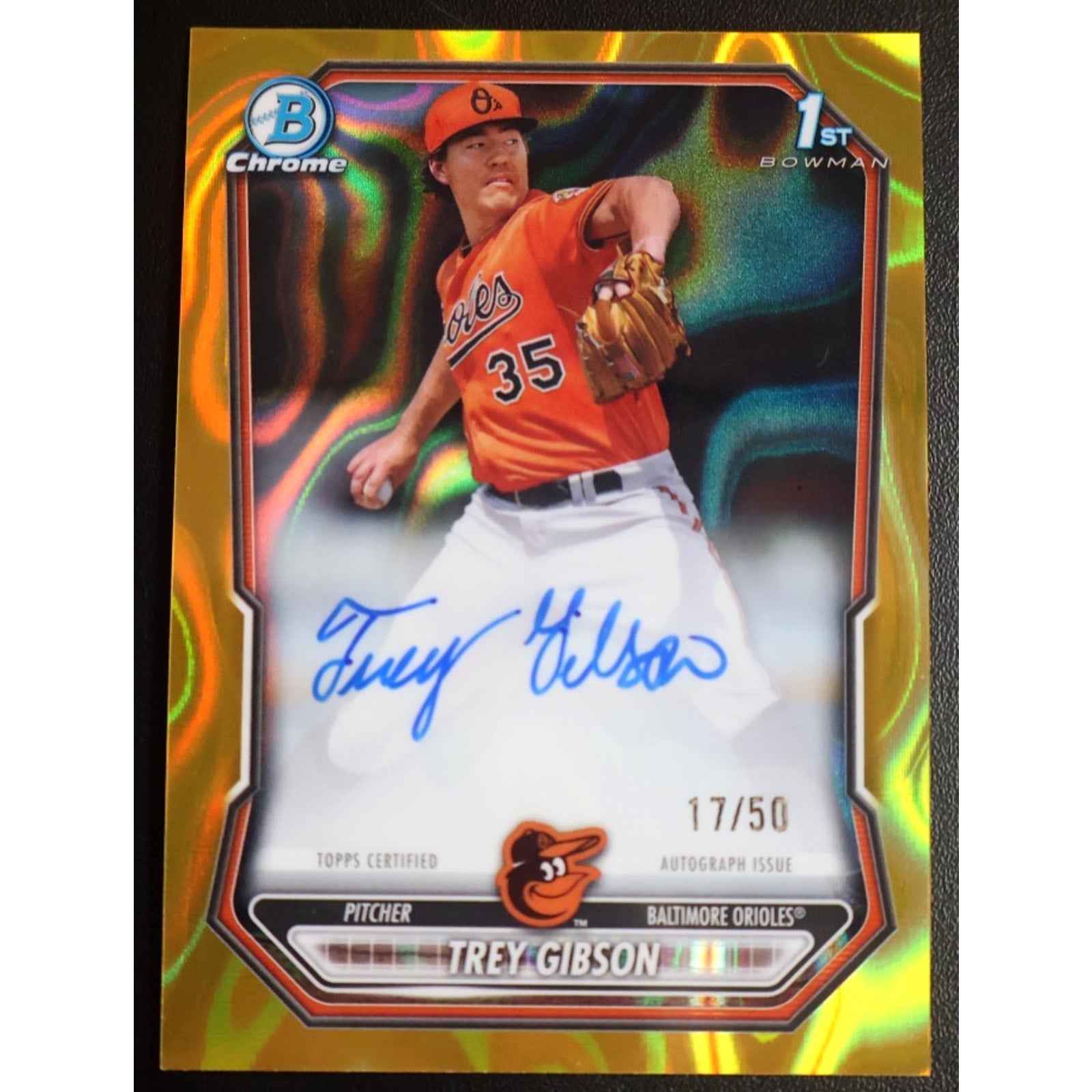 Baseball trading card with a player in an orange uniform and colorful border
