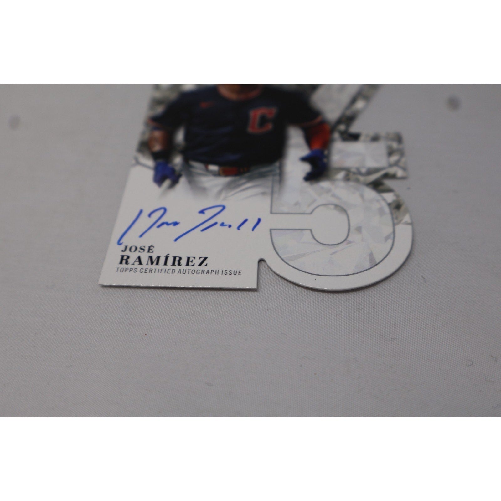 Angled front close-up highlighting Jose Ramirez's blue autograph and the die-cut anniversary design.