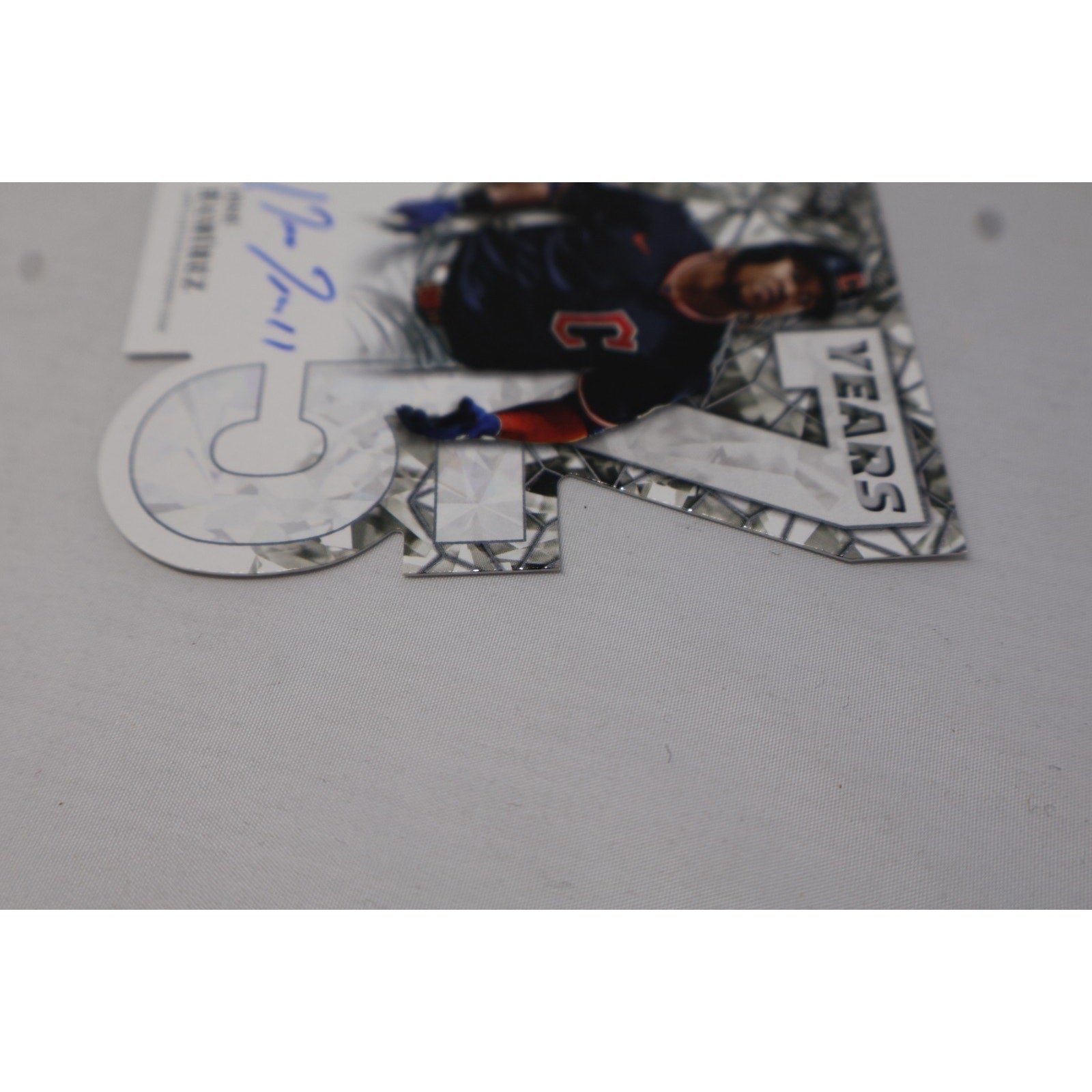 Reverse angled view showing the back surface and die-cut contours of the card.
