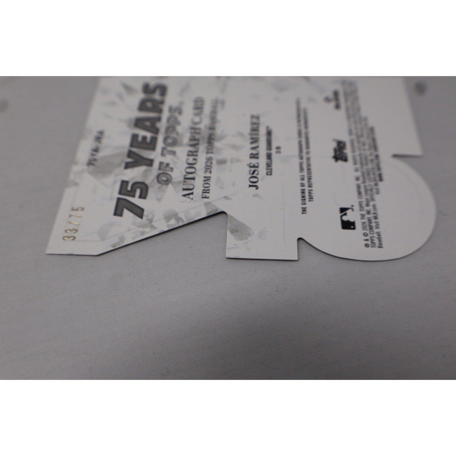 Close-up view of the die-cut shape and card edges, highlighting the unique construction and condition.