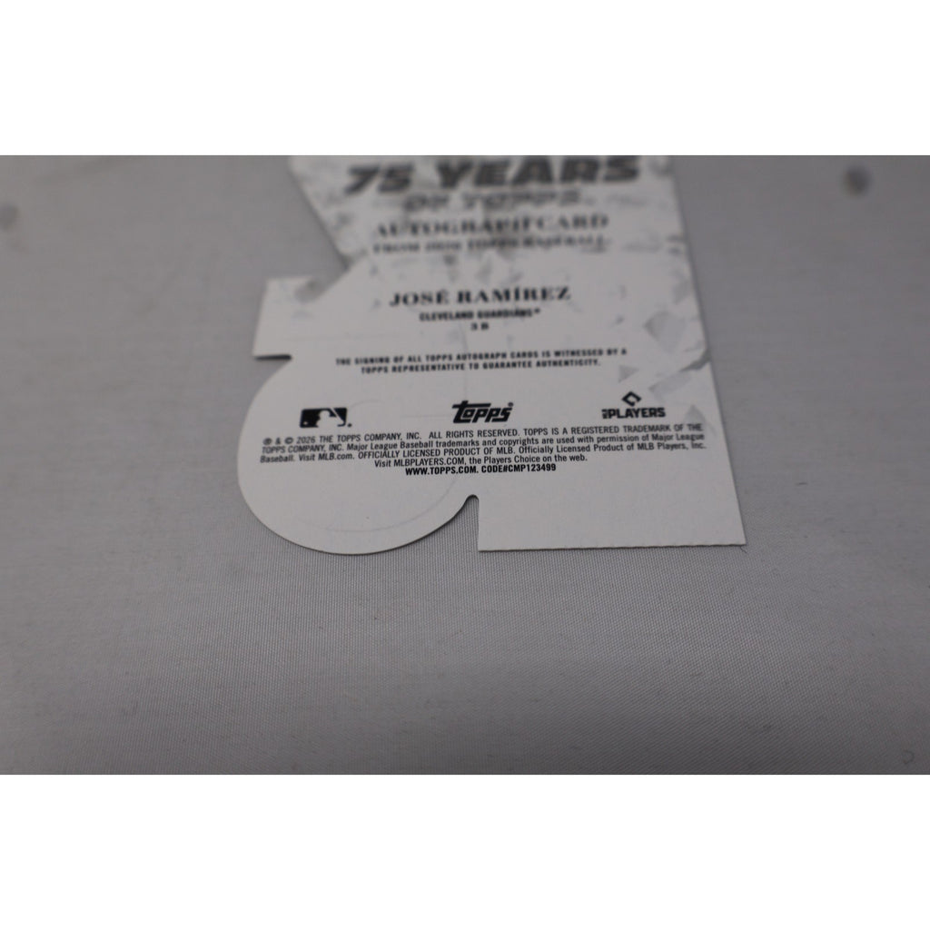 Topps trading card packaging with a card inside on a gray surface