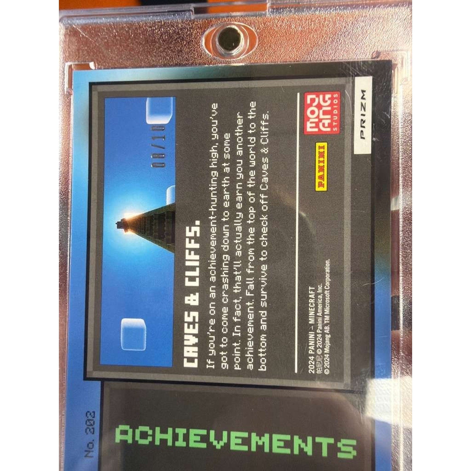 Back of 2024 Panini Prizm Minecraft Achievements #202 Caves & Cliffs Blue Prizm SSP card