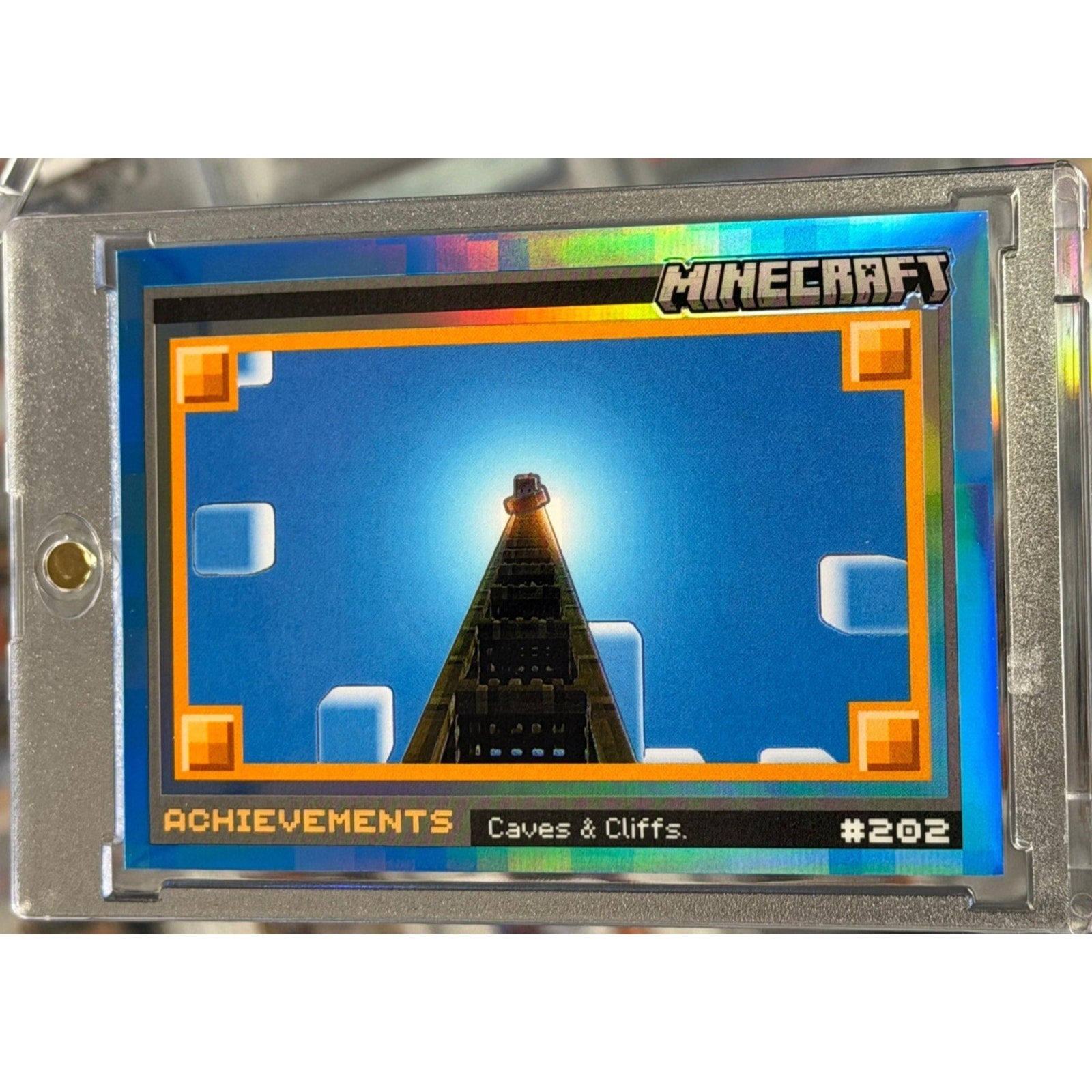 2024 Panini Prizm Minecraft Achievements Caves & Cliffs Blue Prizm SSP card numbered 08 of 10 in magnetic one-touch holder