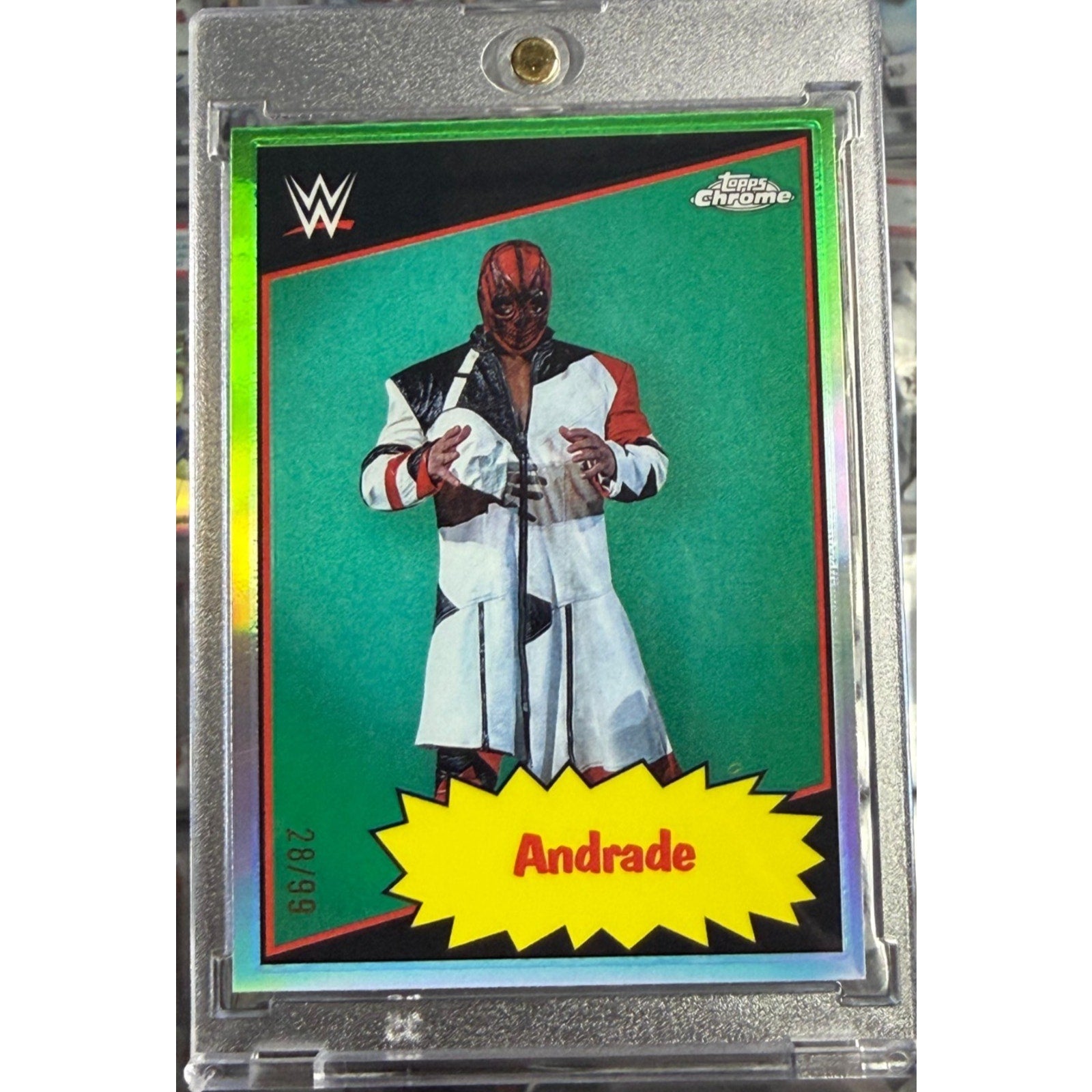 2025 Topps Chrome WWE Andrade 1985 Topps Tribute Green Refractor parallel numbered 28 of 99 in magnetic one-touch holder