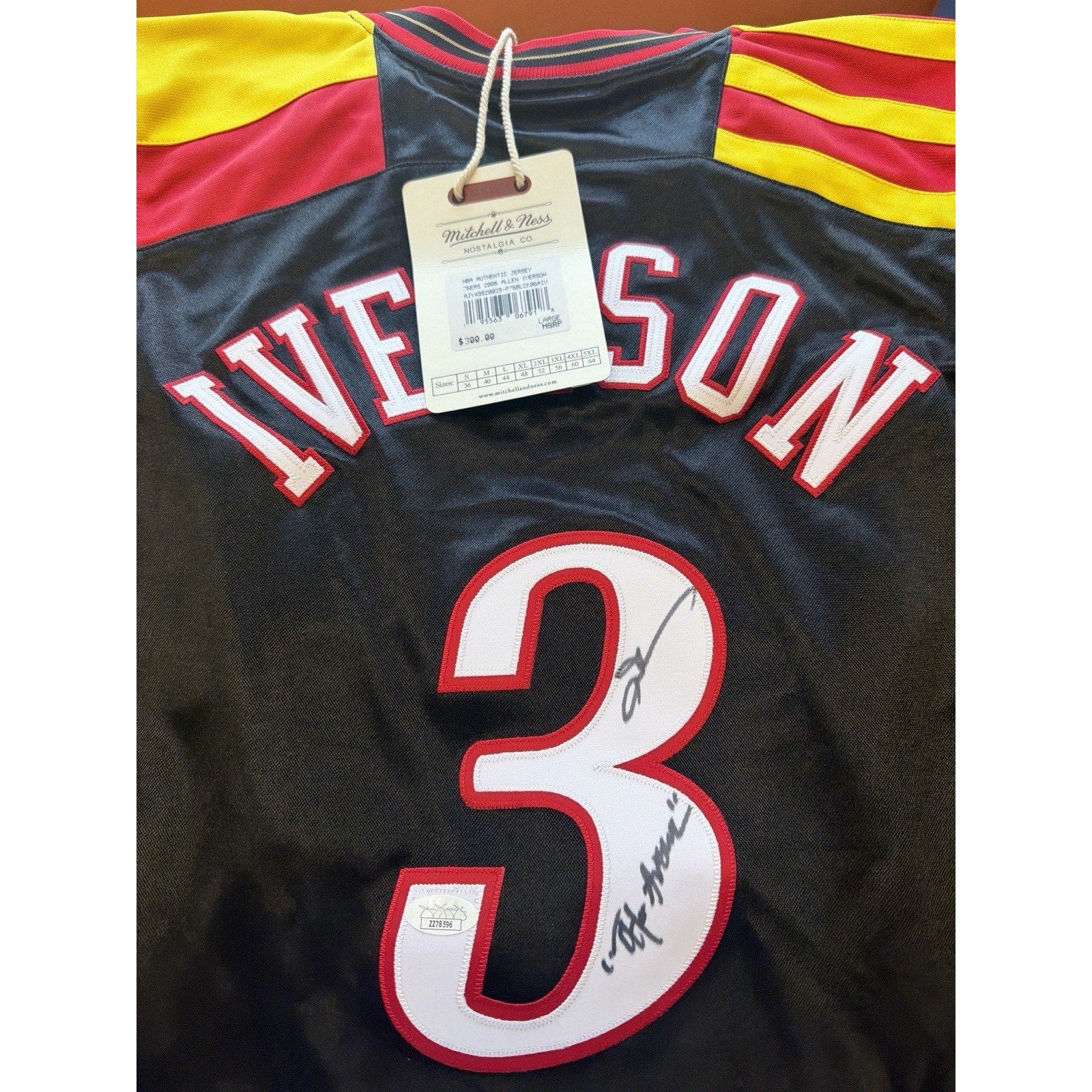 Back of Philadelphia 76ers Allen Iverson jersey displaying number 3 and autograph