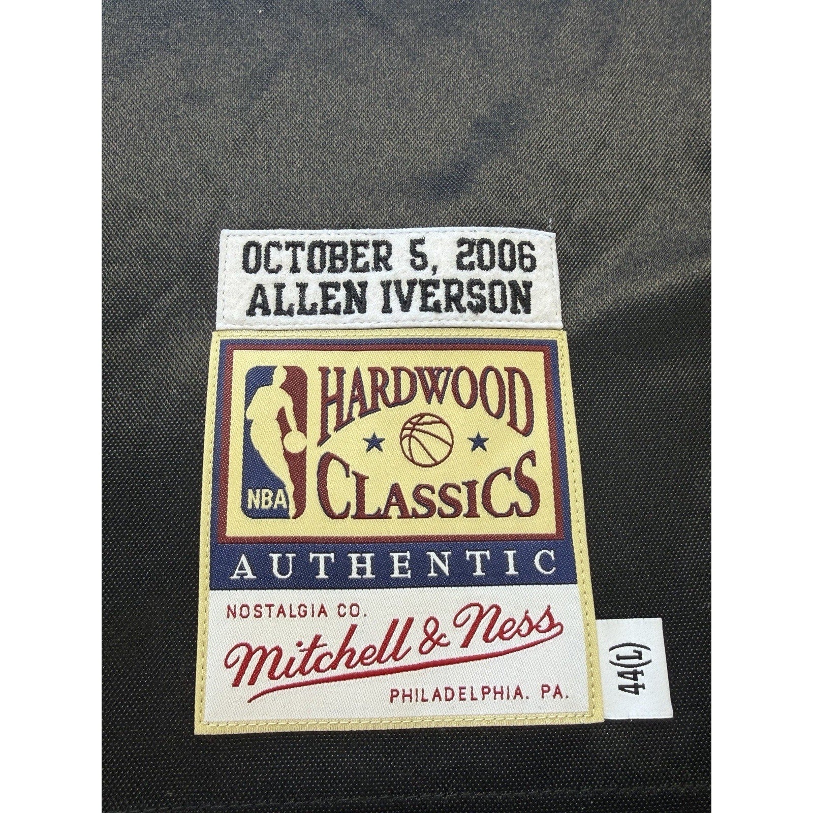 JSA authentication label and Mitchell & Ness tagging on signed Allen Iverson jersey
