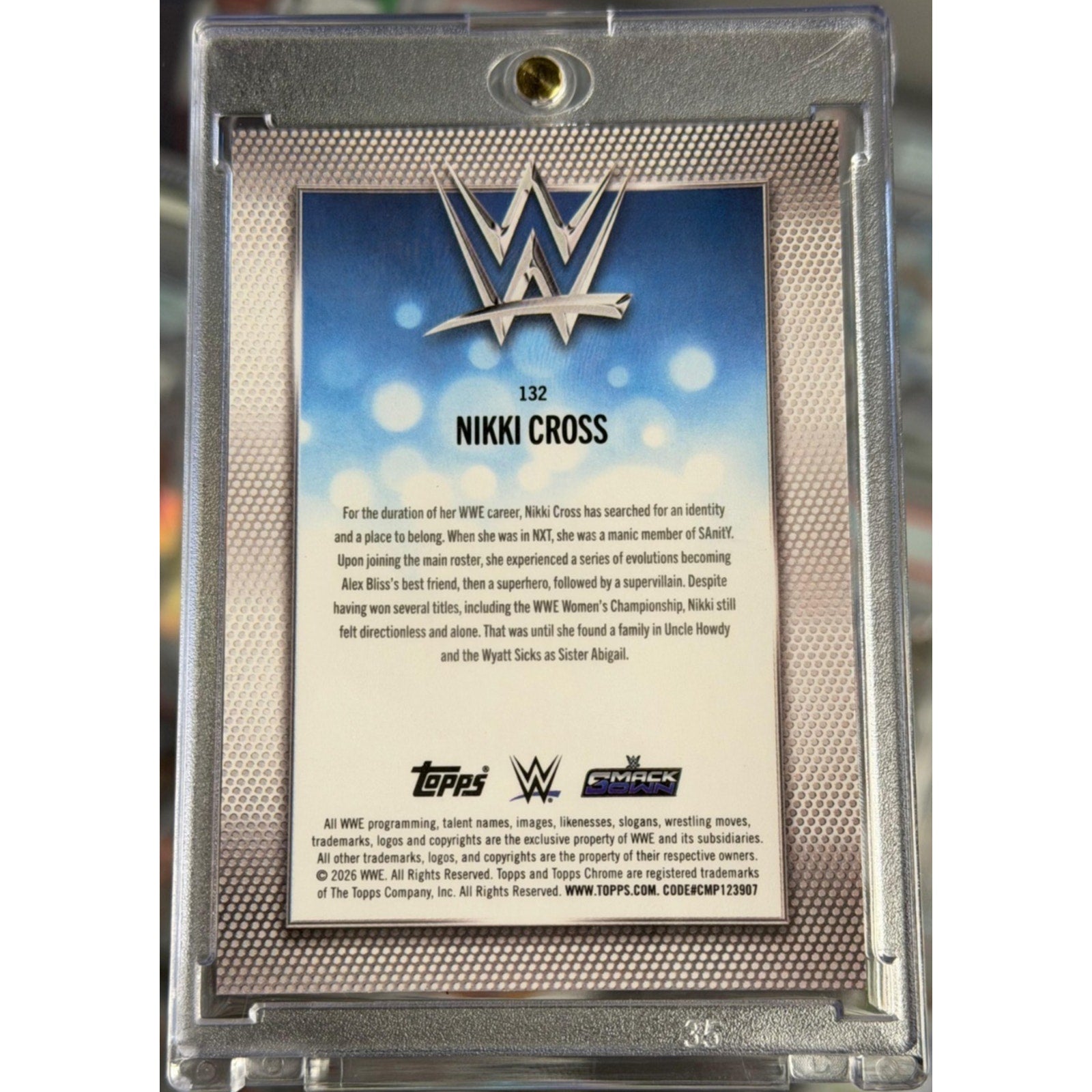 Back of 2026 Topps Chrome WWE Nikki Cross Gold Mini Diamond Refractor SSP card serial numbered to 50