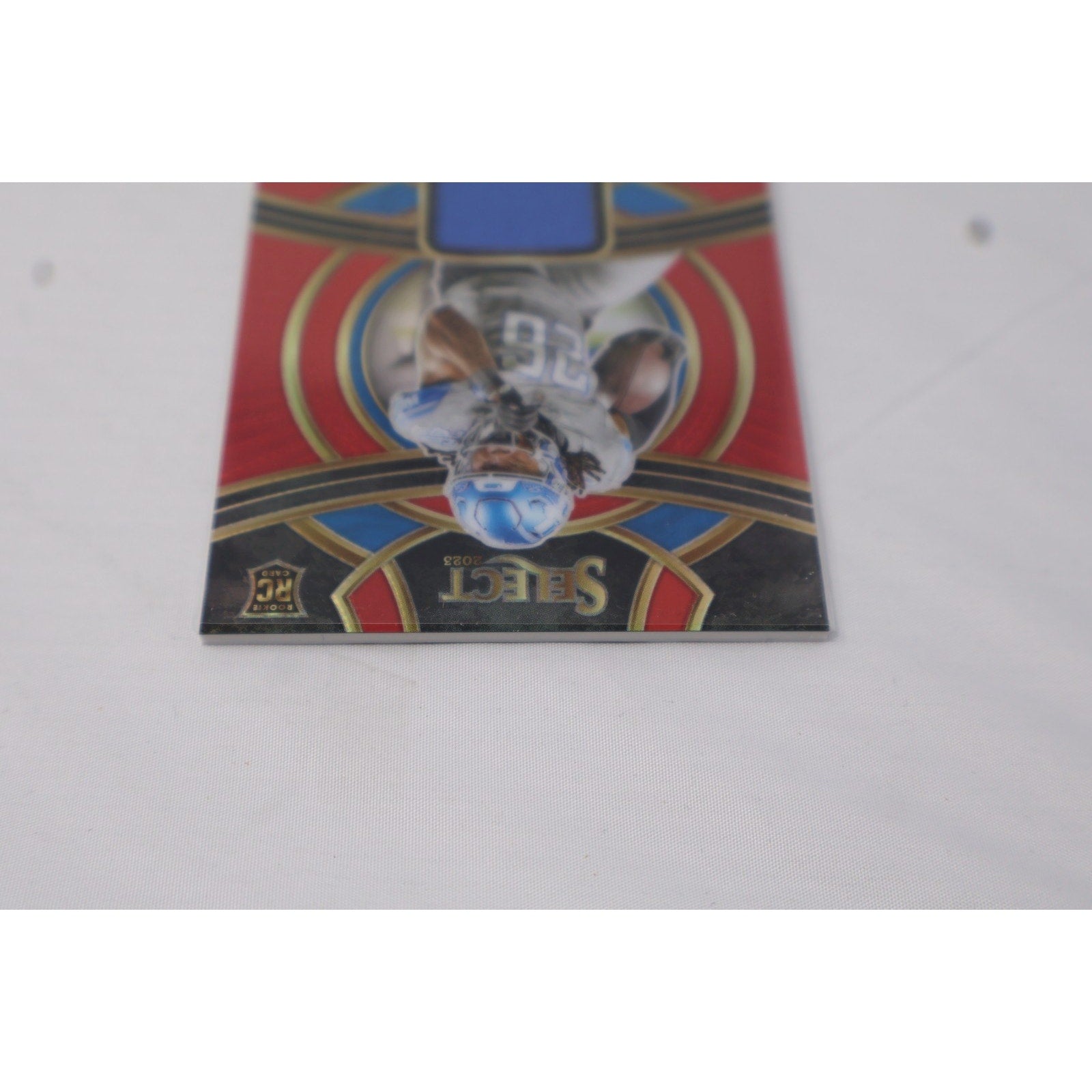 2023 Panini Select - Rookie Swatches Jahmyr Gibbs #RSW-JGI Red Prizm RC Mint