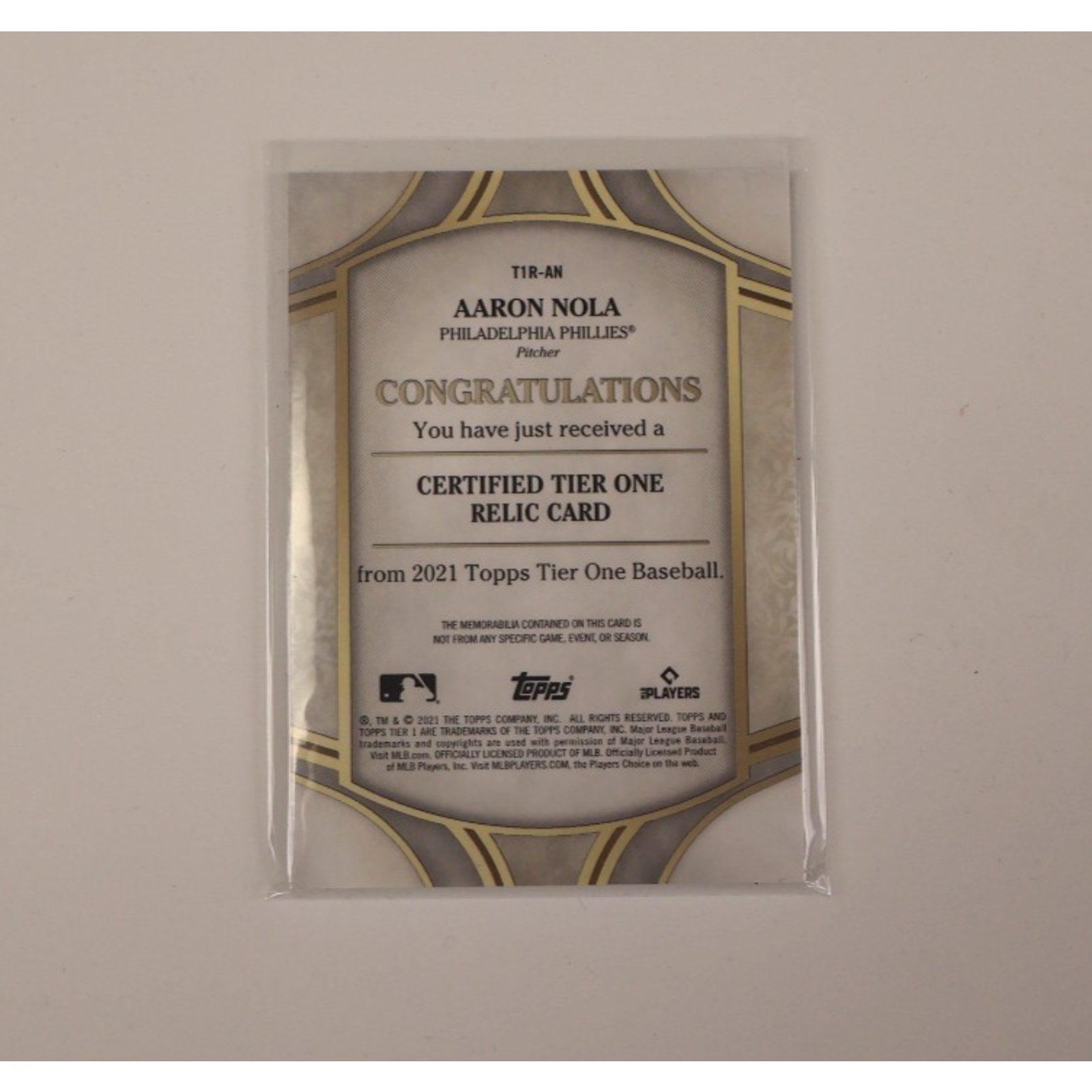 Back view of 2021 Topps Tier One Aaron Nola game-used memorabilia baseball card serial numbered to 399