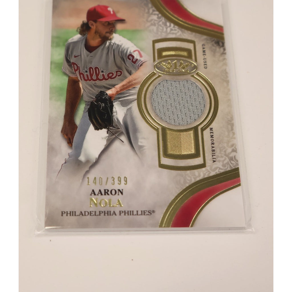Angled front view of Aaron Nola 2021 Topps Tier One memorabilia card featuring certified game-used relic