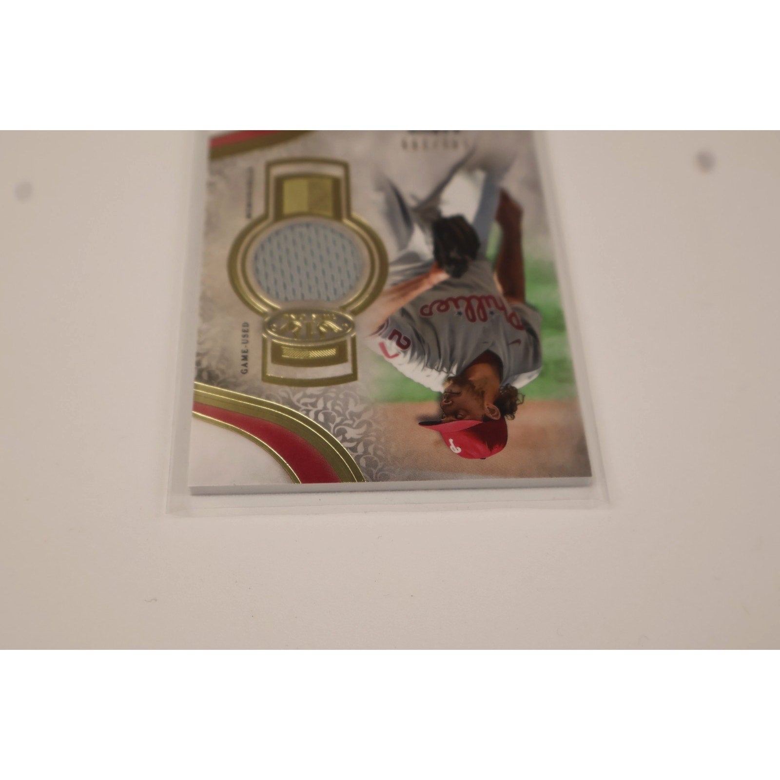 Close-up image of Aaron Nola Topps Tier One memorabilia relic patch and premium card design