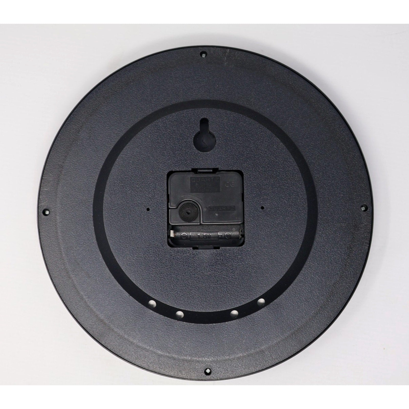 Backside of Aberdeen IronBirds wall clock showing battery compartment and hanging mount