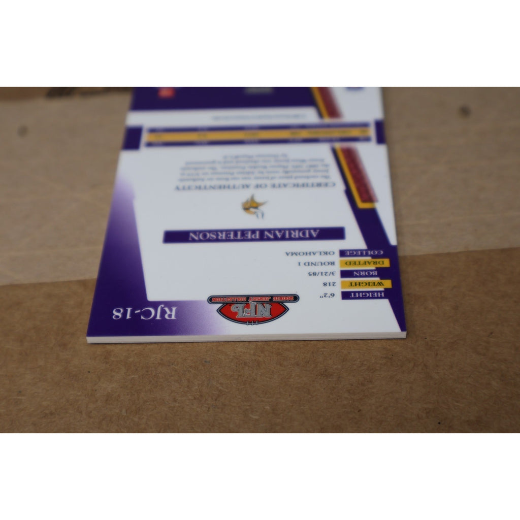 Angled back view of Adrian Peterson rookie memorabilia card from 2007 Playoff Absolute football set