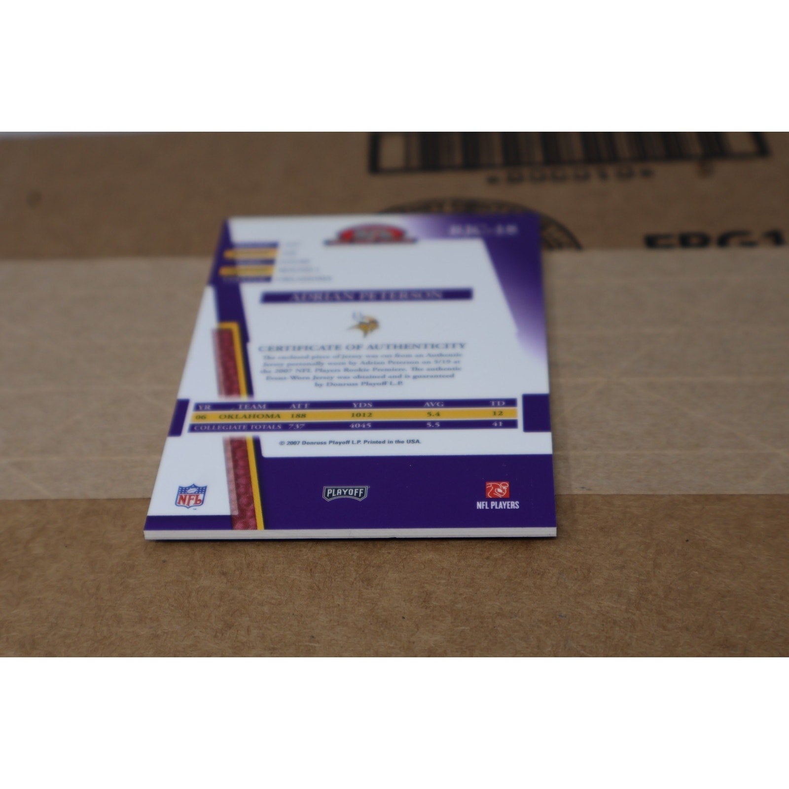 Rear close-up of Adrian Peterson Rookie Jersey Collection card featuring official NFL trading card details
