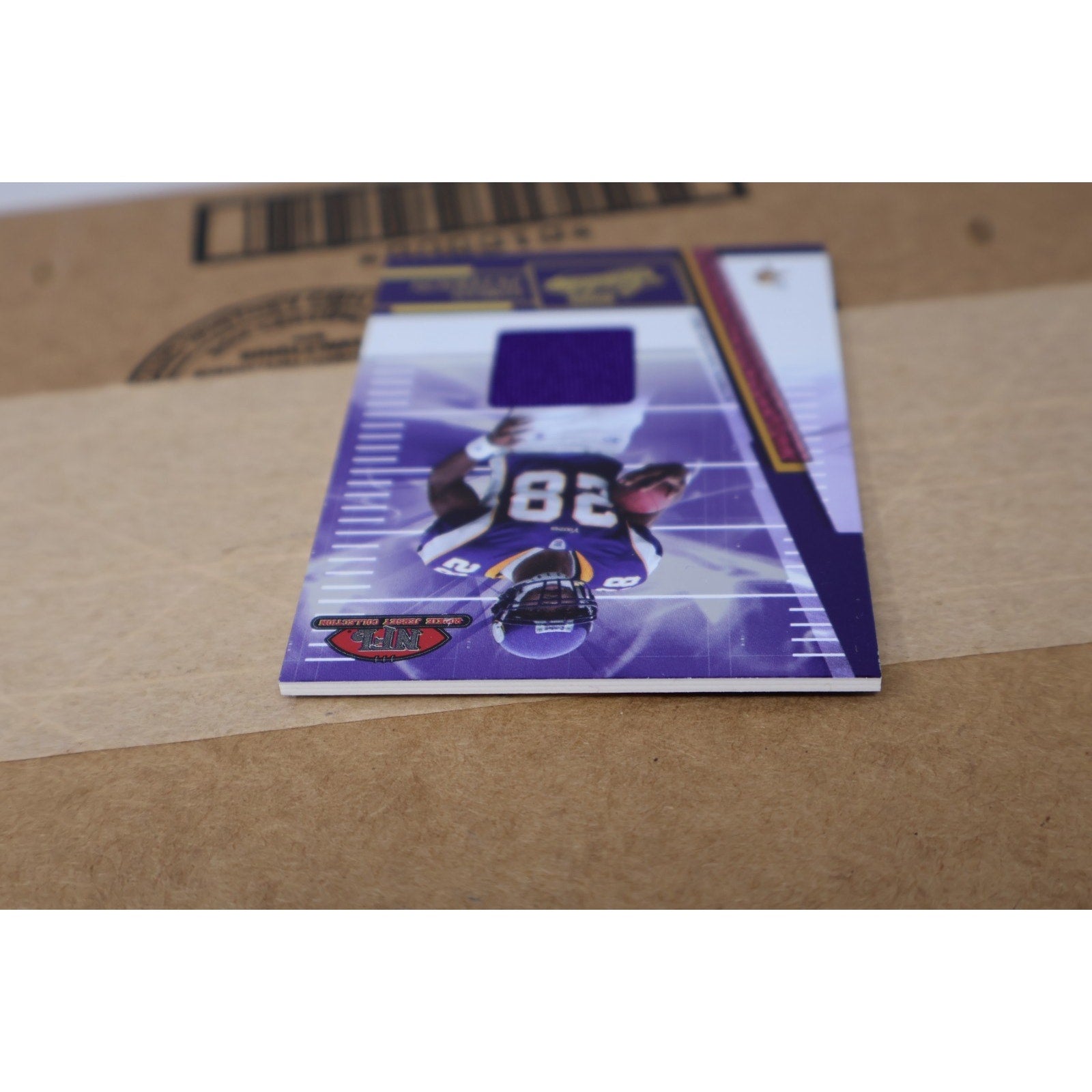 Side angle view of 2007 Adrian Peterson rookie jersey patch football card collectible