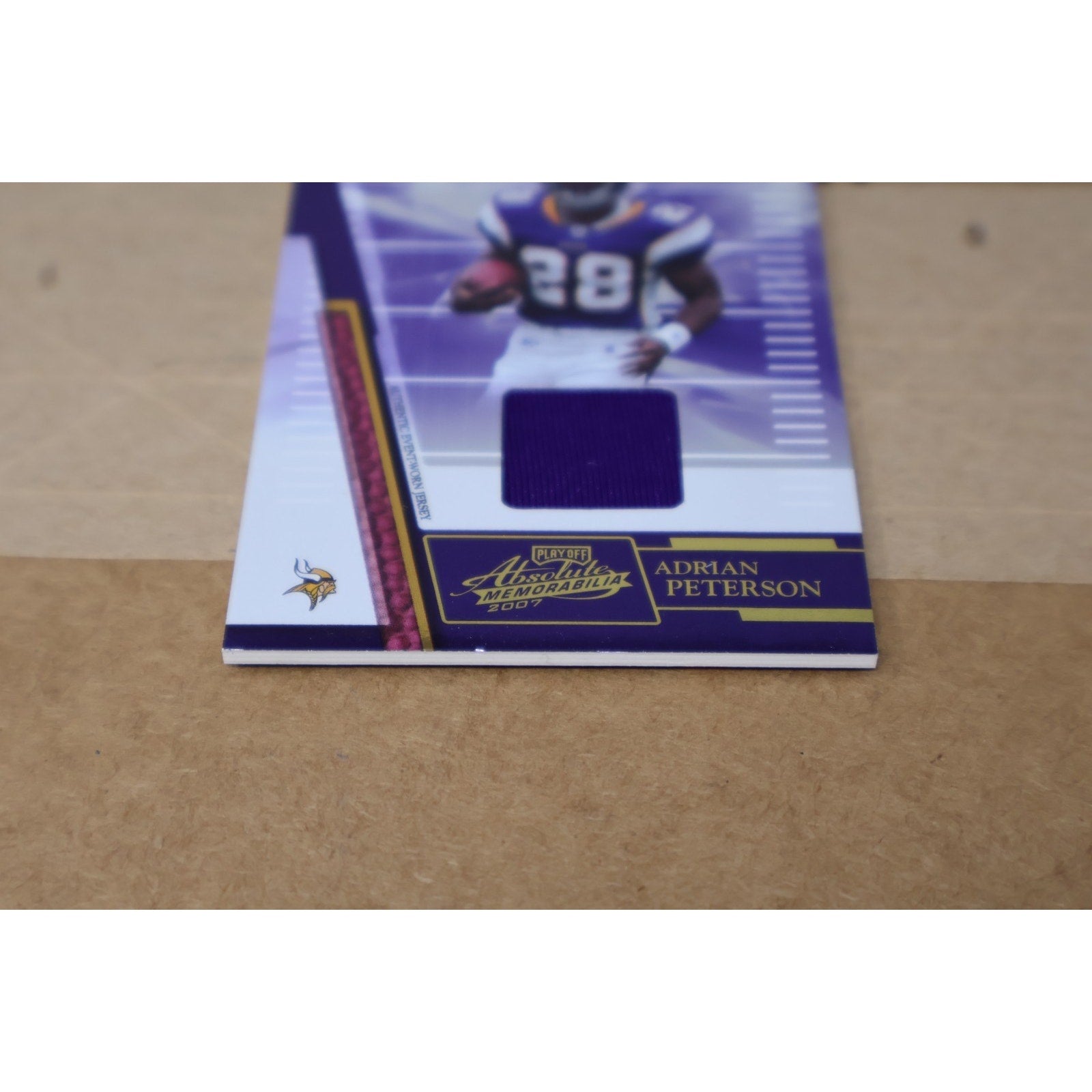 Front angled display of Adrian Peterson 2007 Absolute Memorabilia rookie patch card for Minnesota Vikings collectors