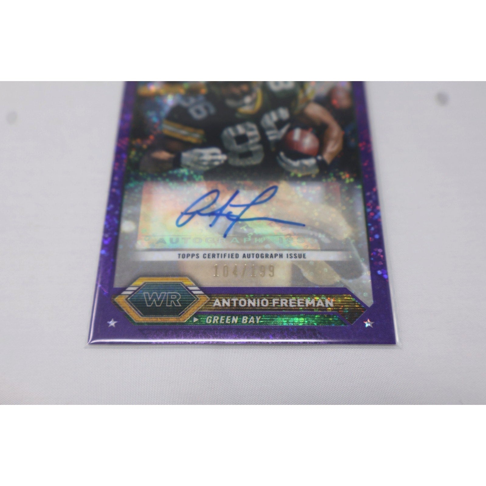 Front angled view of Antonio Freeman Purple Speckle autograph football card from 2024 Topps Chrome Composite