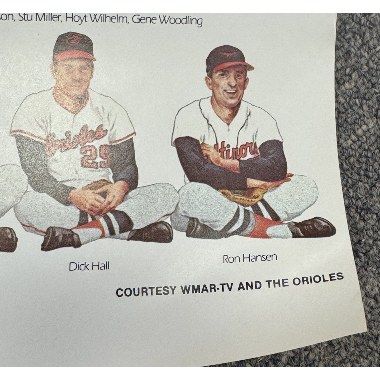 Close-up section of Baltimore Orioles anniversary poster featuring vintage player portraits and classic team memorabilia design