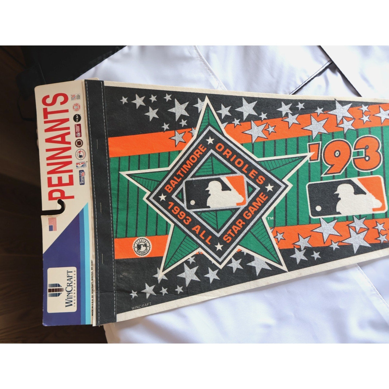 Close-up of 1993 MLB All-Star Game artwork and Orioles-themed graphics on pennant