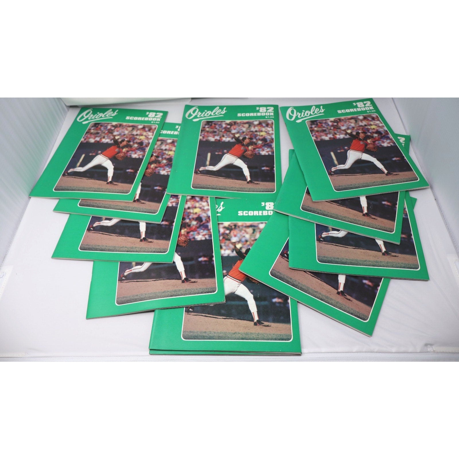 Lot of 11 vintage 1982 Baltimore Orioles scorebooks featuring classic MLB baseball programs and collectible team memorabilia