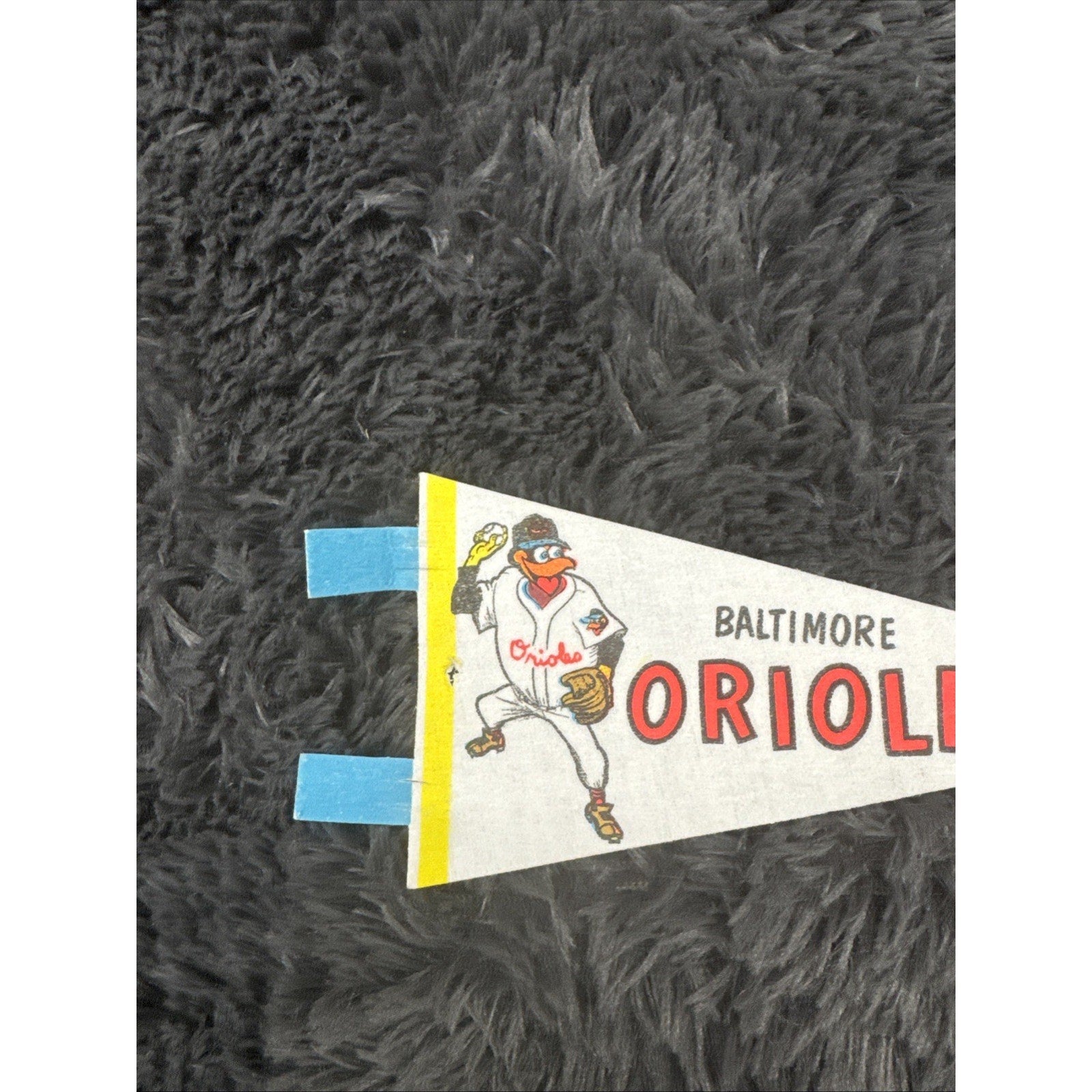 Angled front view of vintage Baltimore Orioles mini pennant featuring classic Front Page Bird mascot artwork