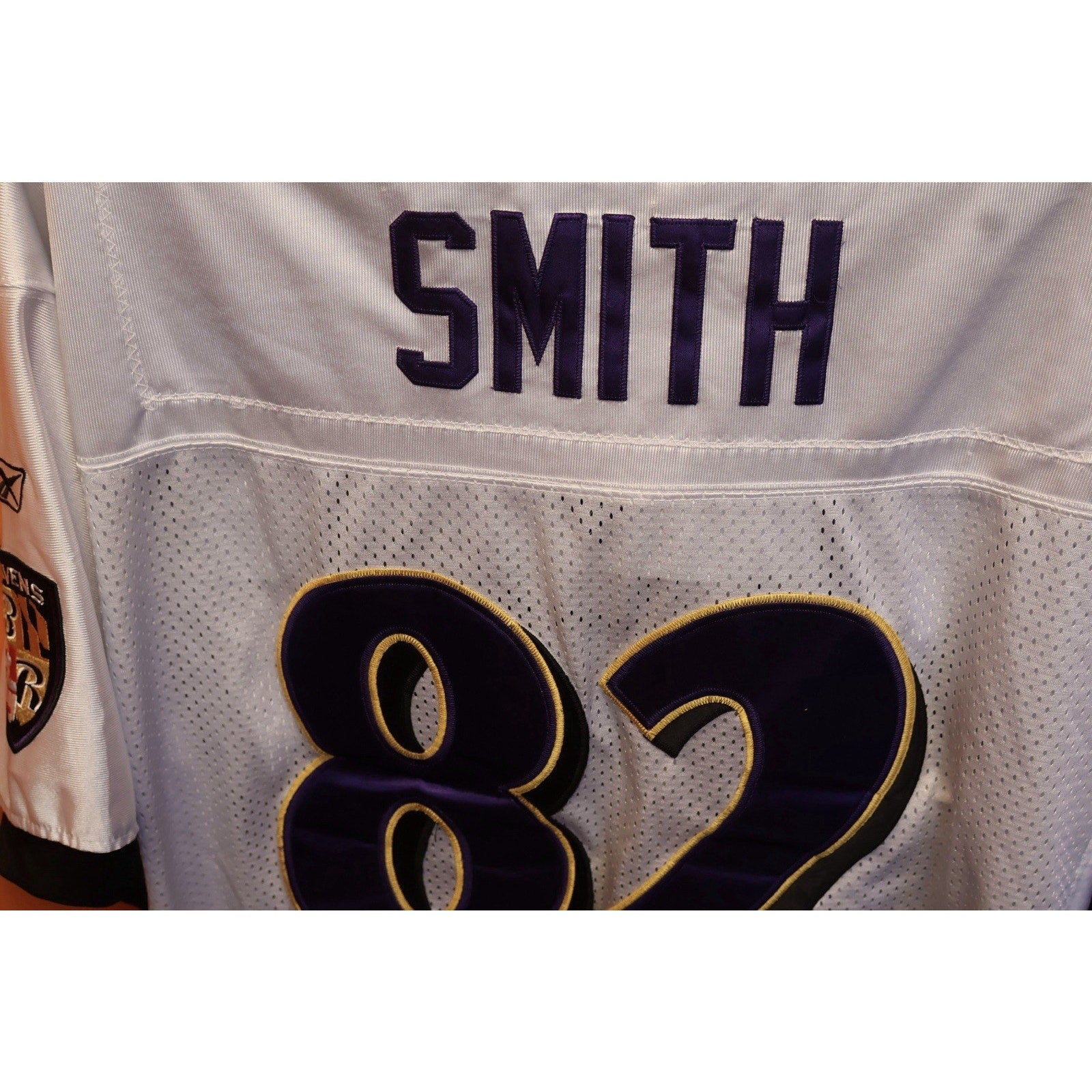 Gray sports jersey with 'Smith' and number '82' on a white background