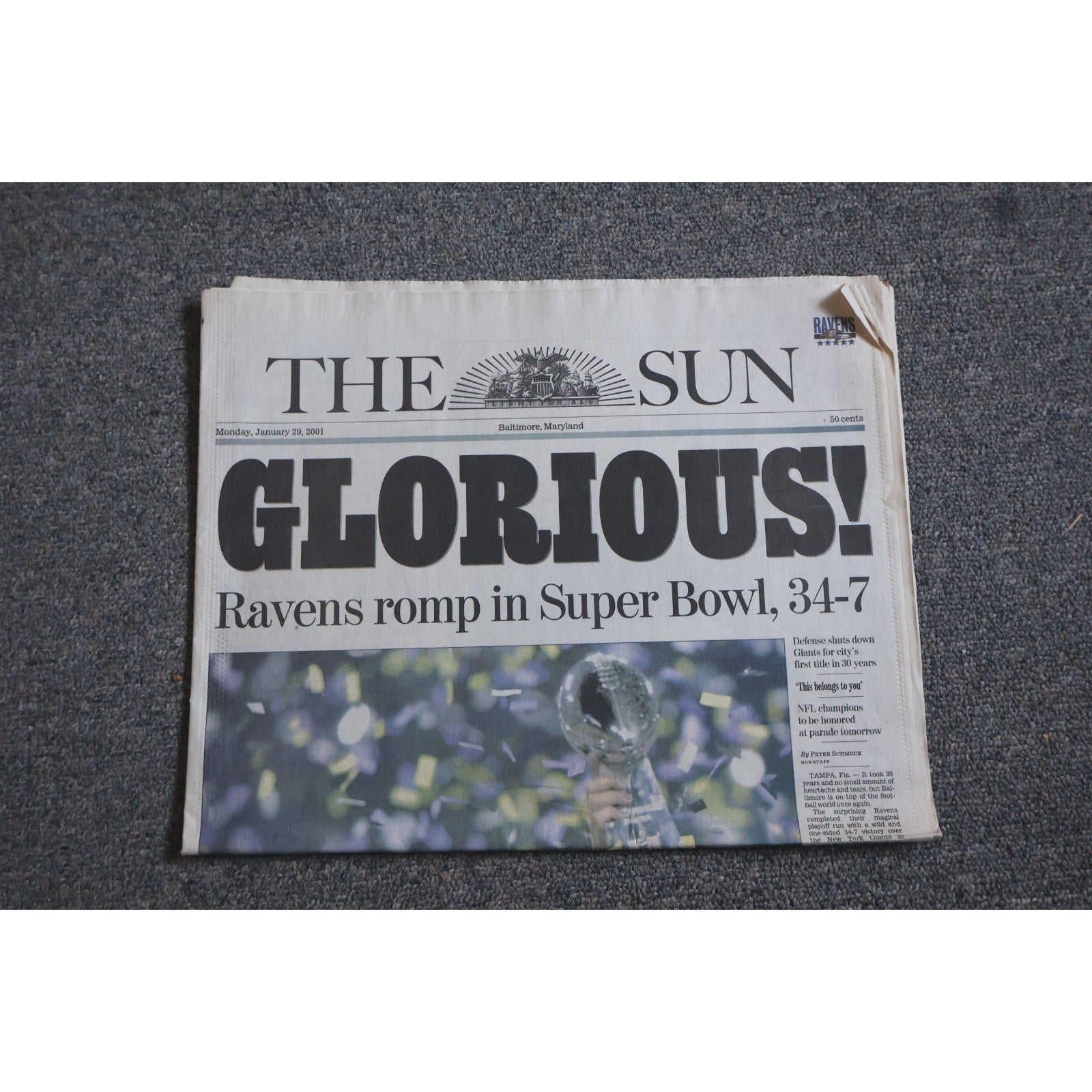 Baltimore Ravens 2001 Super Bowl Champions newspaper front page from The Baltimore Sun featuring GLORIOUS headline