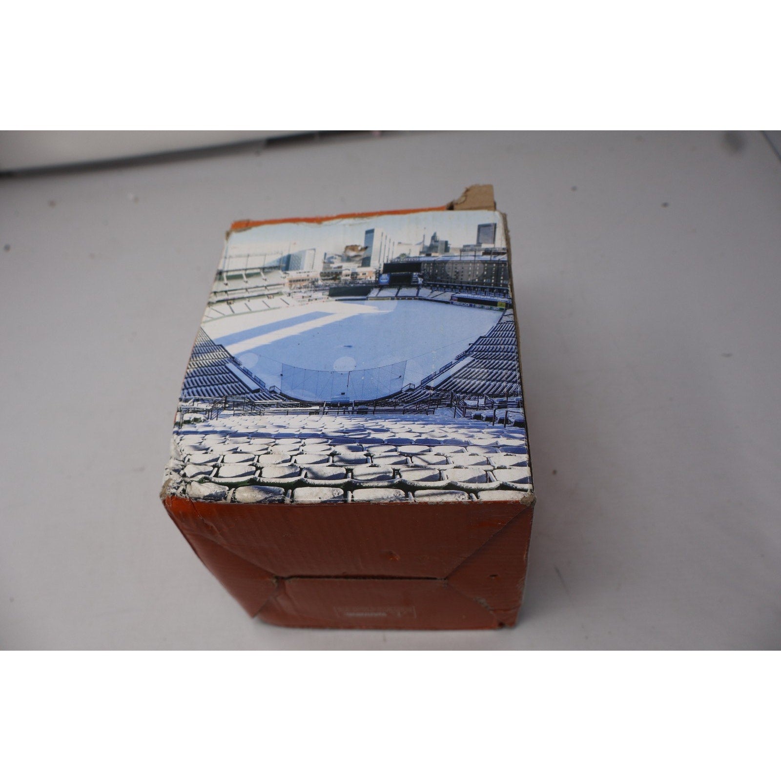Small rectangular box with a printed design on a plain background