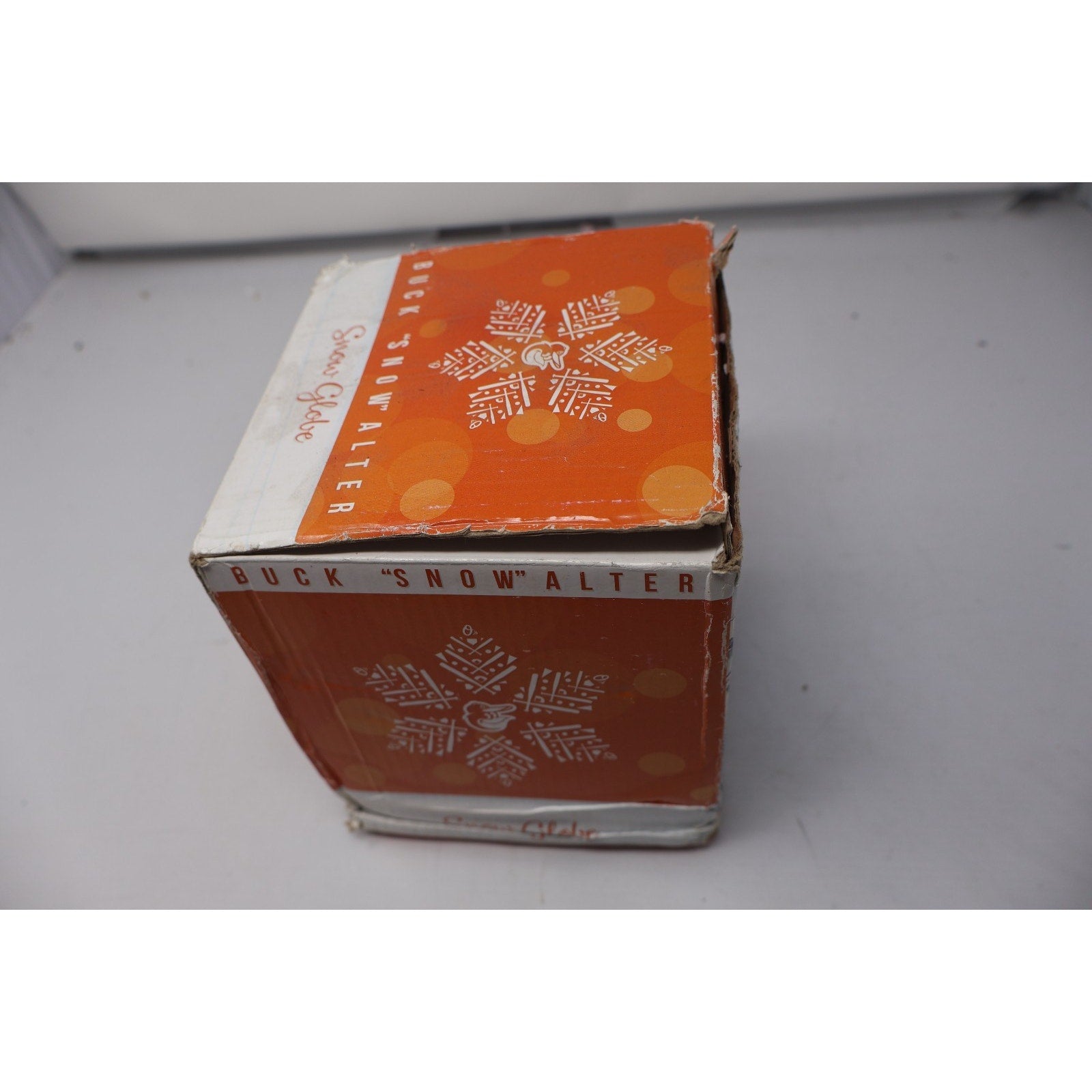 Vintage box with snowflake design on a white surface