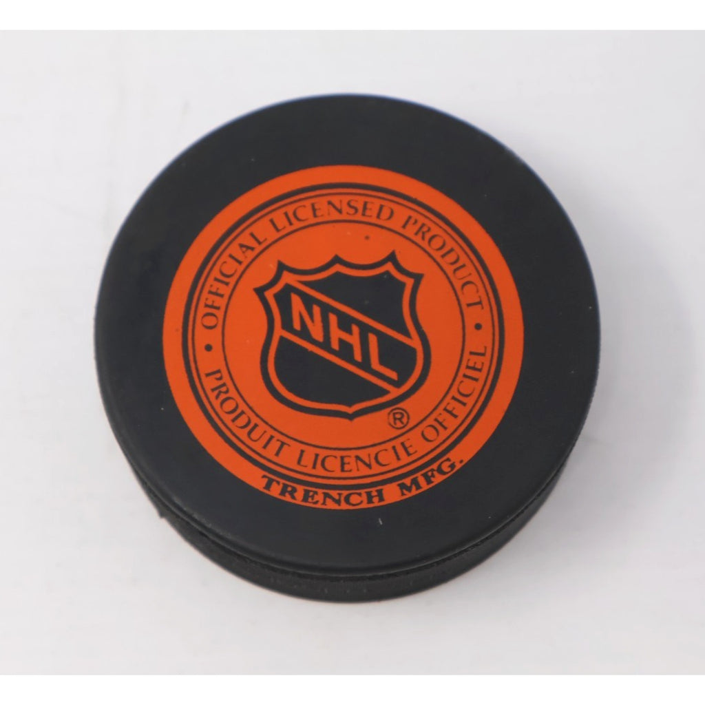 Back view of official NHL Tampa Bay Lightning hockey puck with league branding