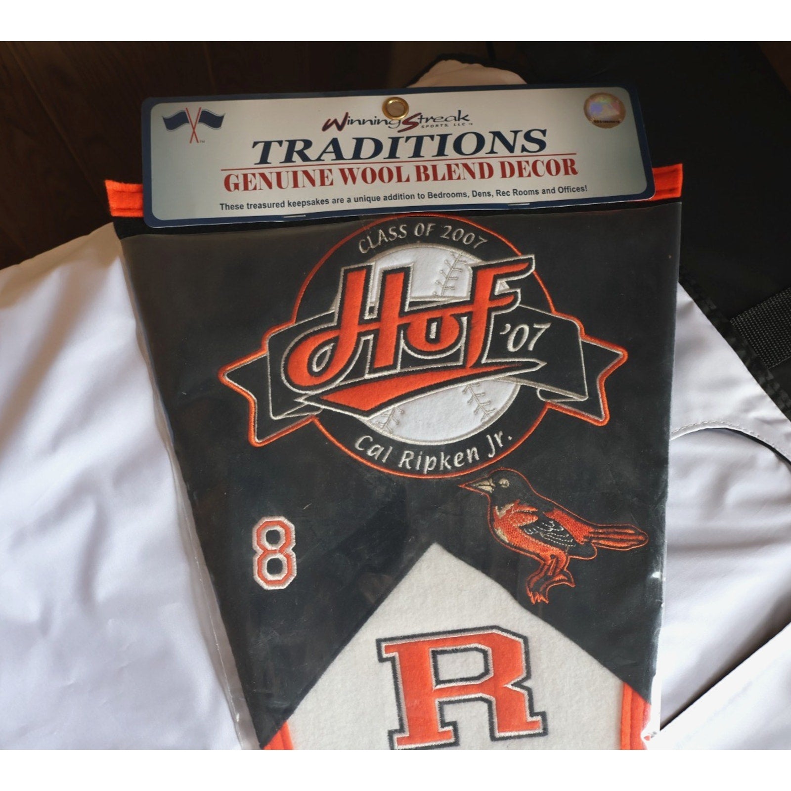 Close-up of Hall of Fame themed Baltimore Orioles pennant graphics and Cal Ripken Jr tribute design