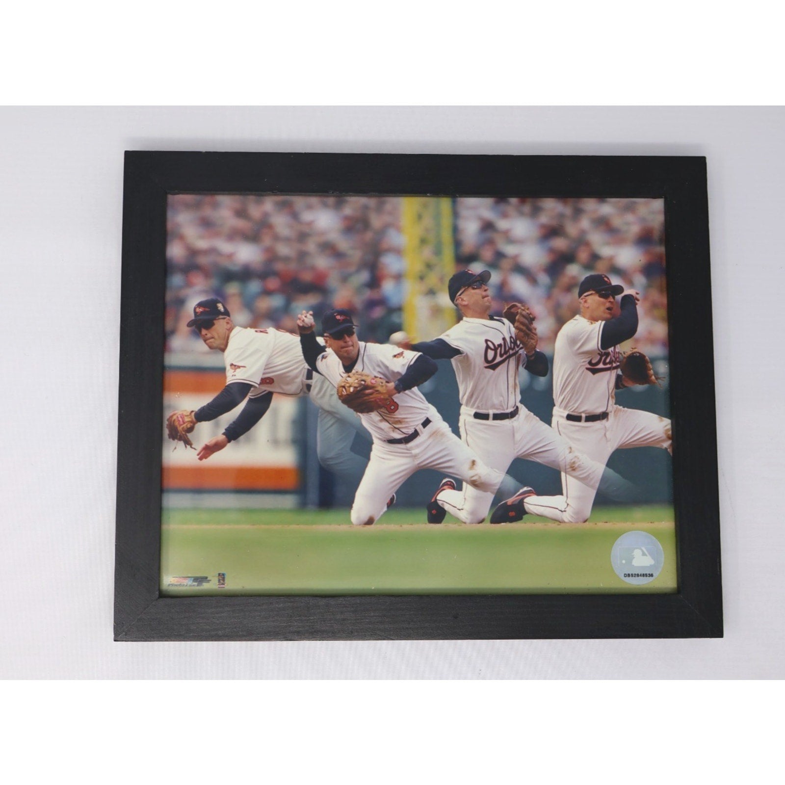 Front view of framed Cal Ripken Jr Baltimore Orioles diving sequence action photo display