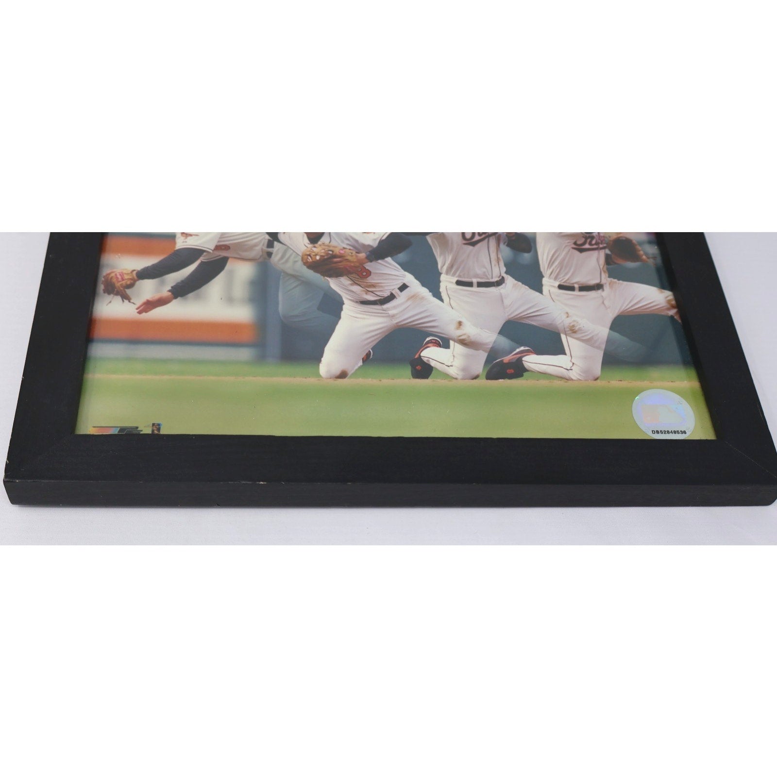 Close-up side angle of Cal Ripken Jr diving play framed photograph