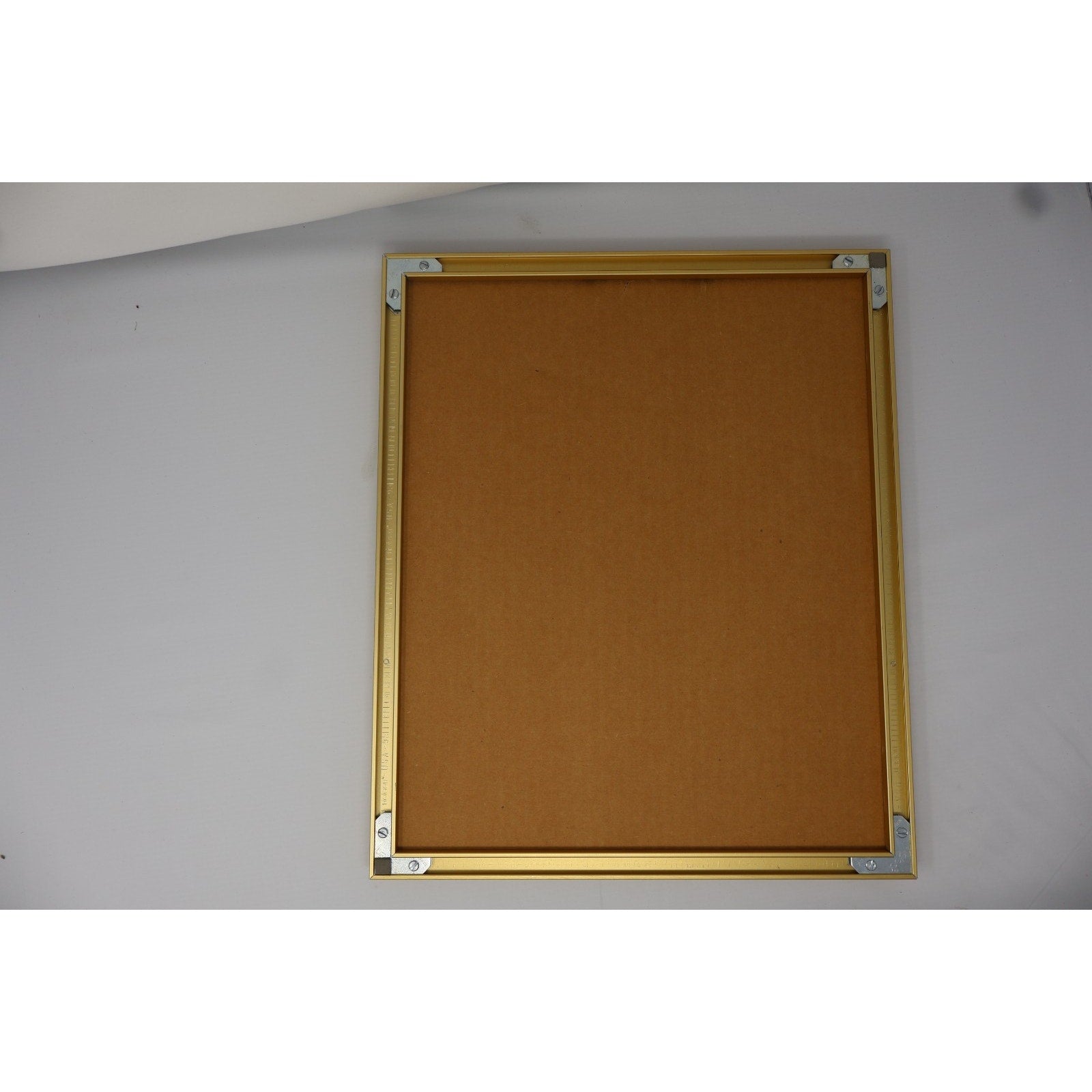 Backside of framed Cal Ripken Jr cartoon sketch display with hanging hardware