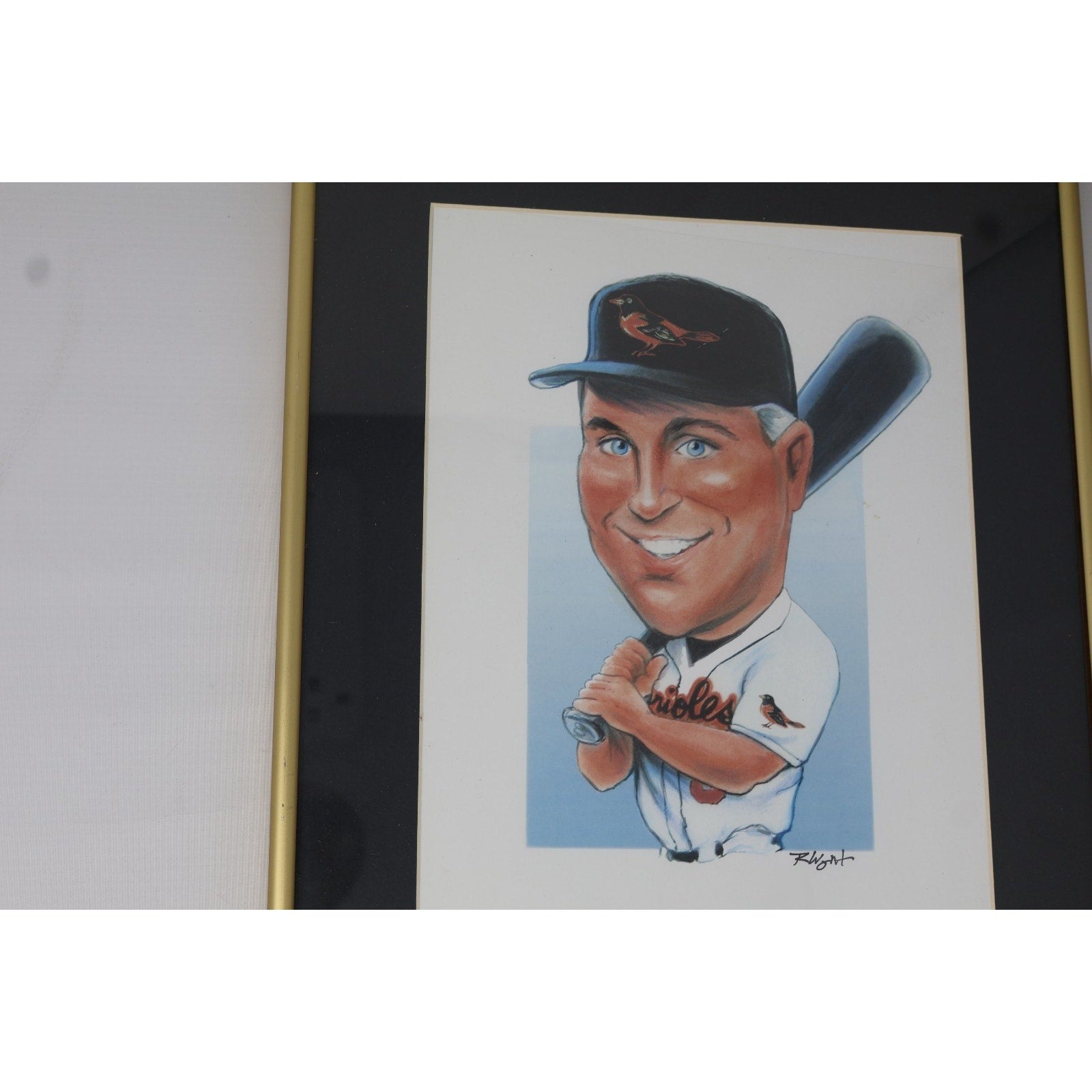 Angled close-up view of Cal Ripken Jr caricature artwork in decorative frame