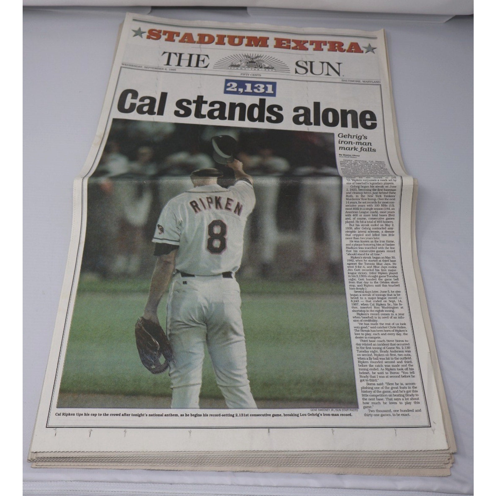 Stacked copies of September 6 1995 Baltimore Sun Stadium Extra Cal Ripken Jr commemorative newspaper edition