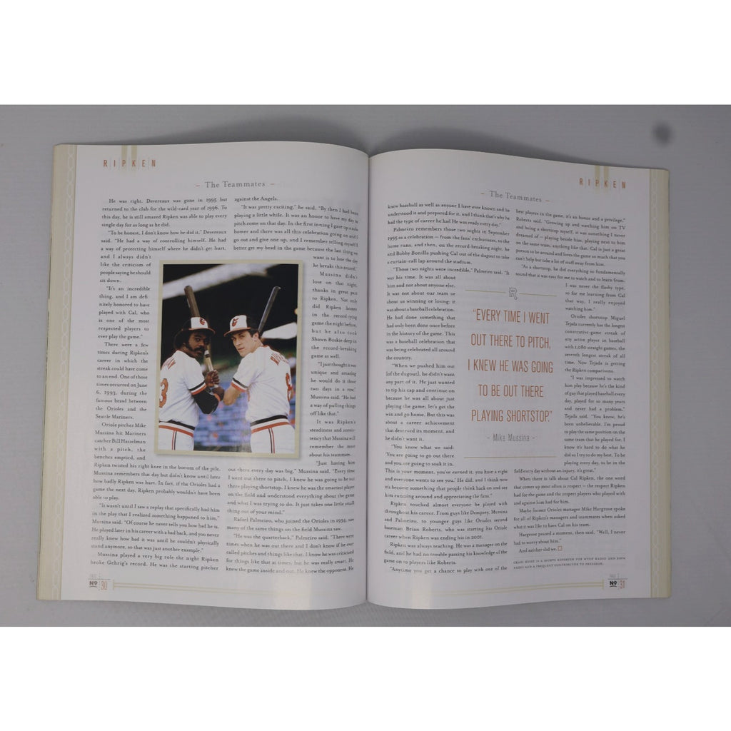 Vintage Cal Ripken Jr Sports Illustrated magazine displayed with baseball memorabilia collection