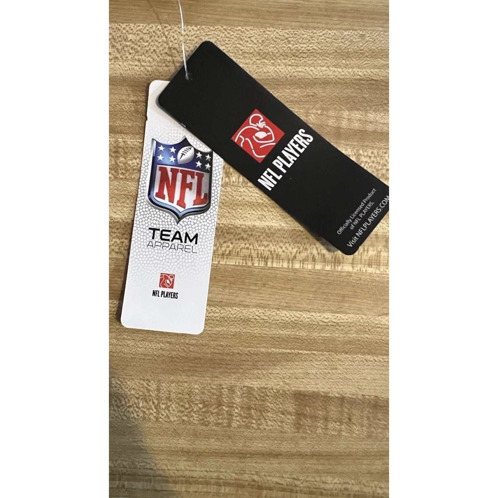 Official NFL merchandise tags attached to Joe Burrow youth jersey