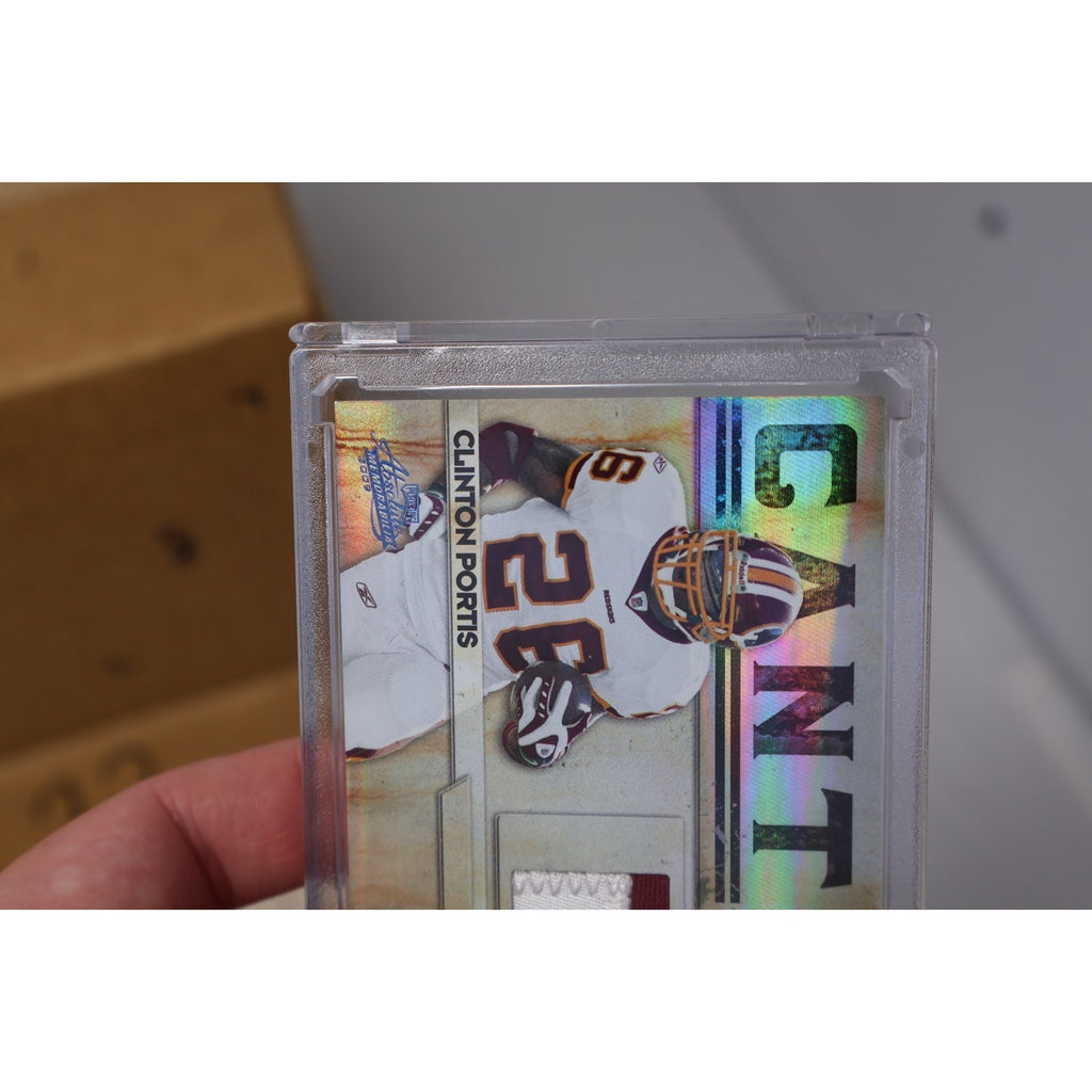 Side angle view of Clinton Portis 2009 Panini Absolute jersey relic football card in protective holder