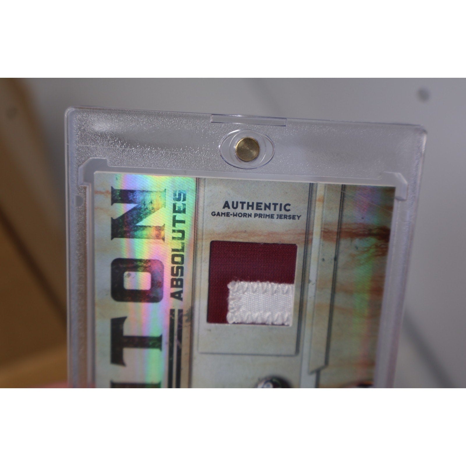 Reverse side close-up of Clinton Portis game used memorabilia card featuring serial numbering and player information