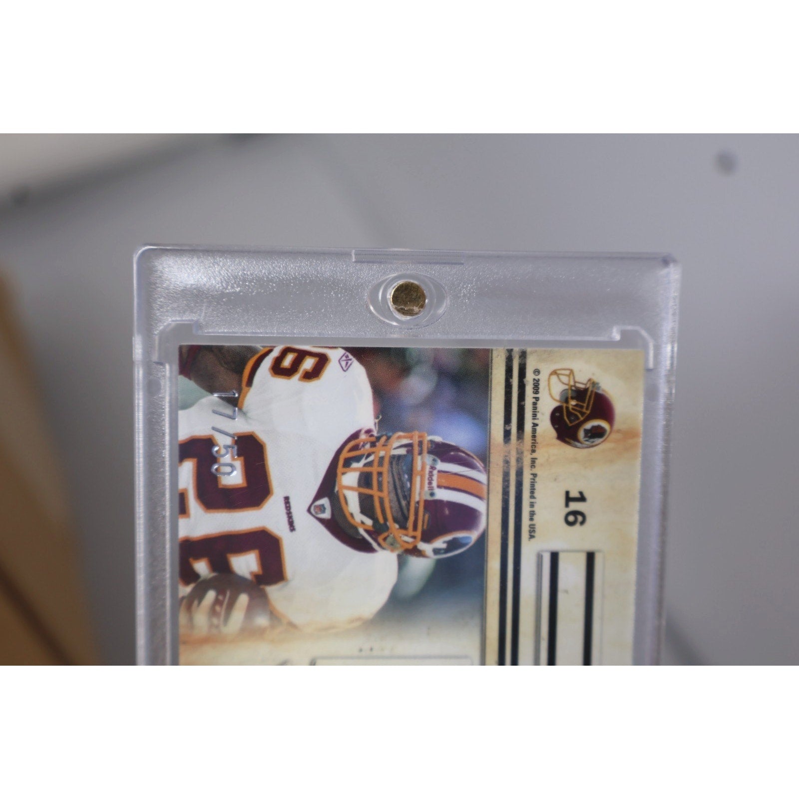 Front angled view of 2009 Panini Canton Absolutes Clinton Portis jersey patch card collectible